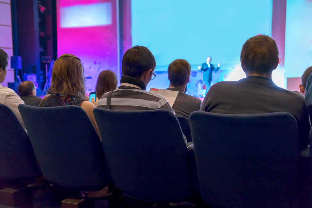 people sitting rear at the business conference